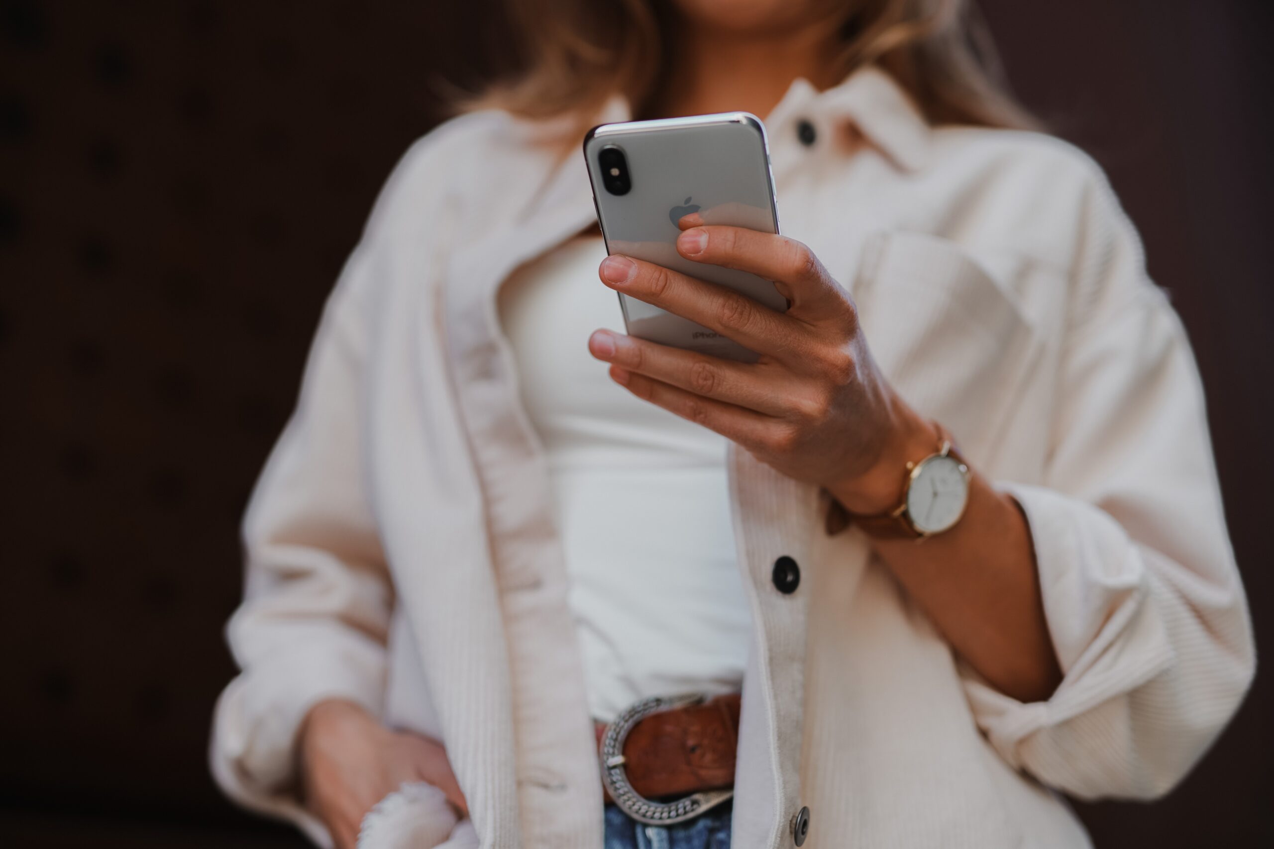woman holding iPhone in hand